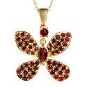 Pendentif papillon grenats